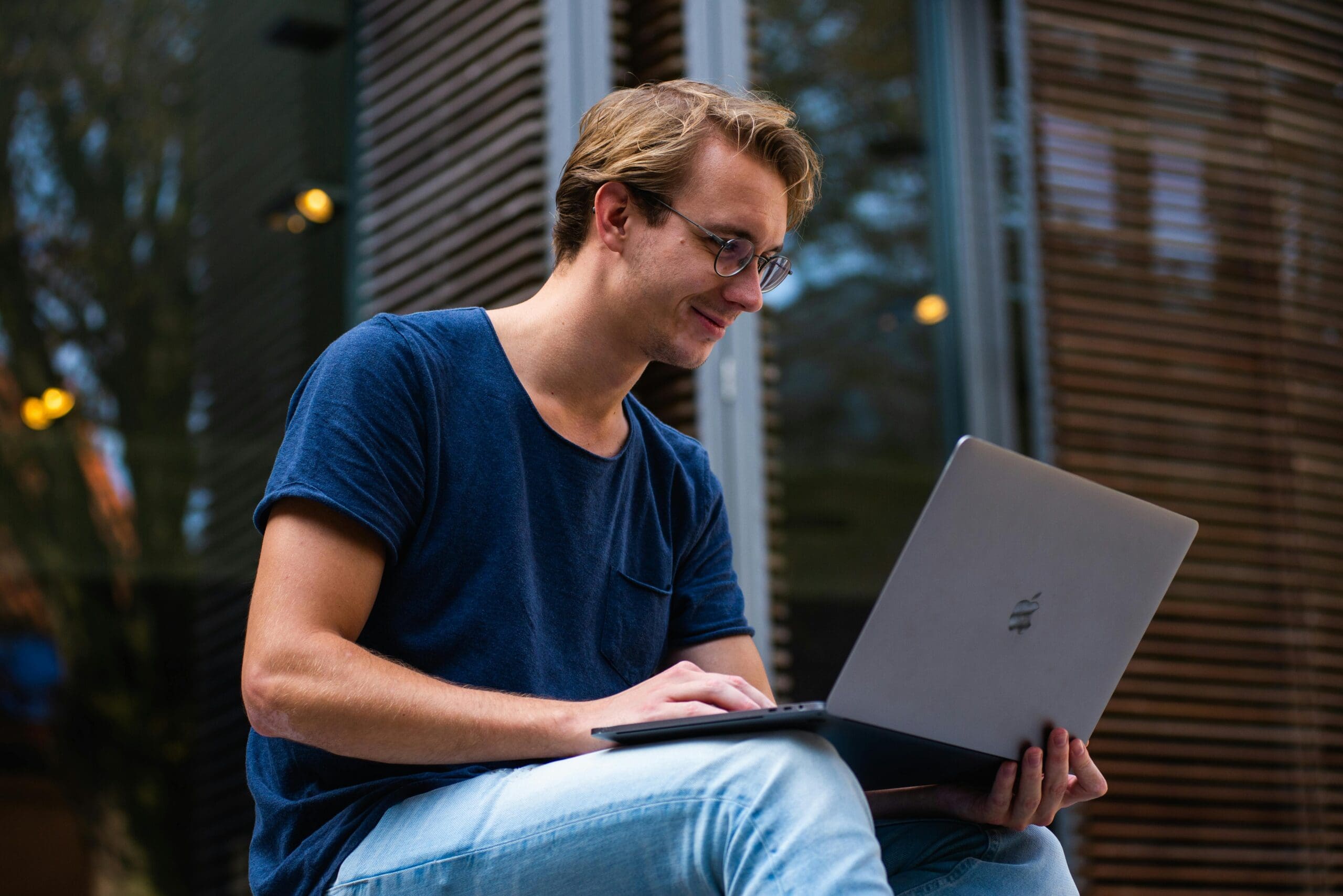 Young man sitting and using a laptop